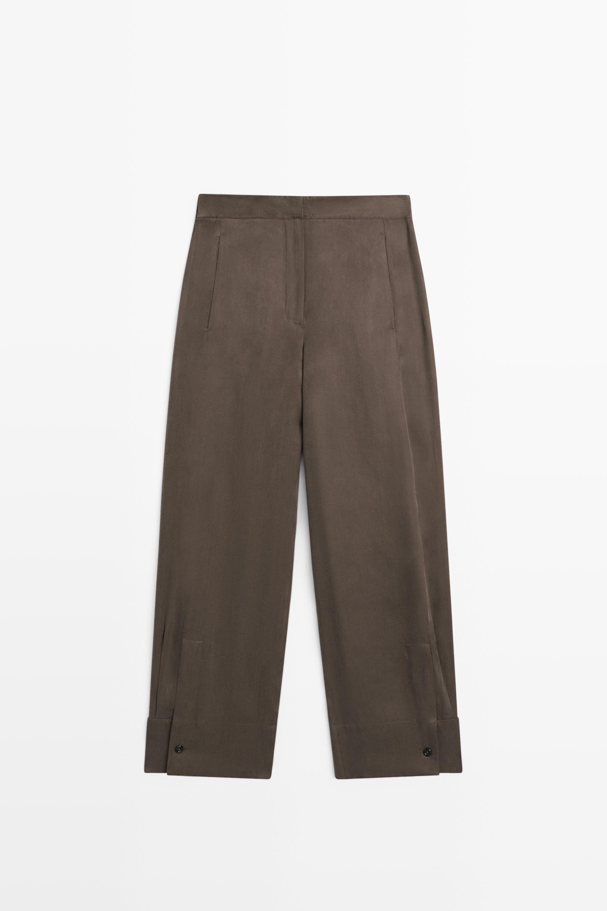 Total look flowing trousers with buttoned hems